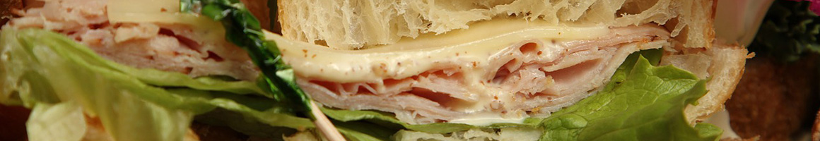 Eating Sandwich at Tubs Gourmet Subs restaurant in Lynnwood, WA.